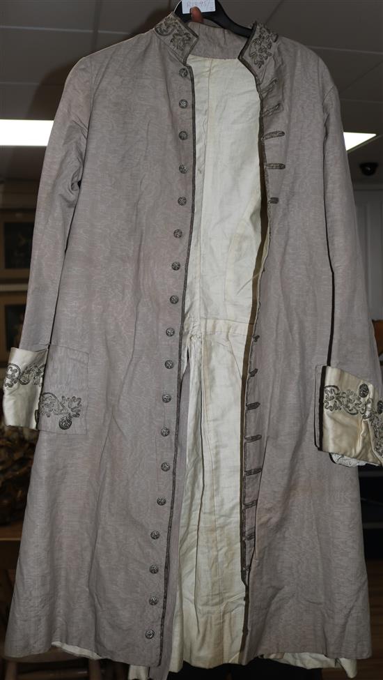 A gentlemans 19th century summer frock coat with gold braiding